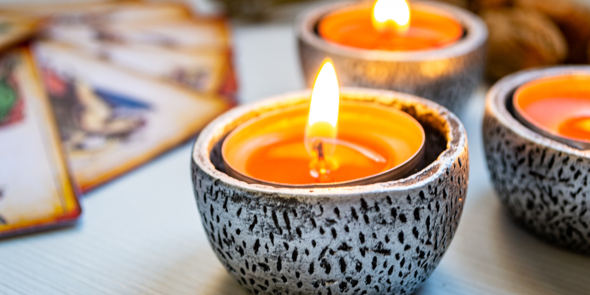 Candles and tarot cards.
