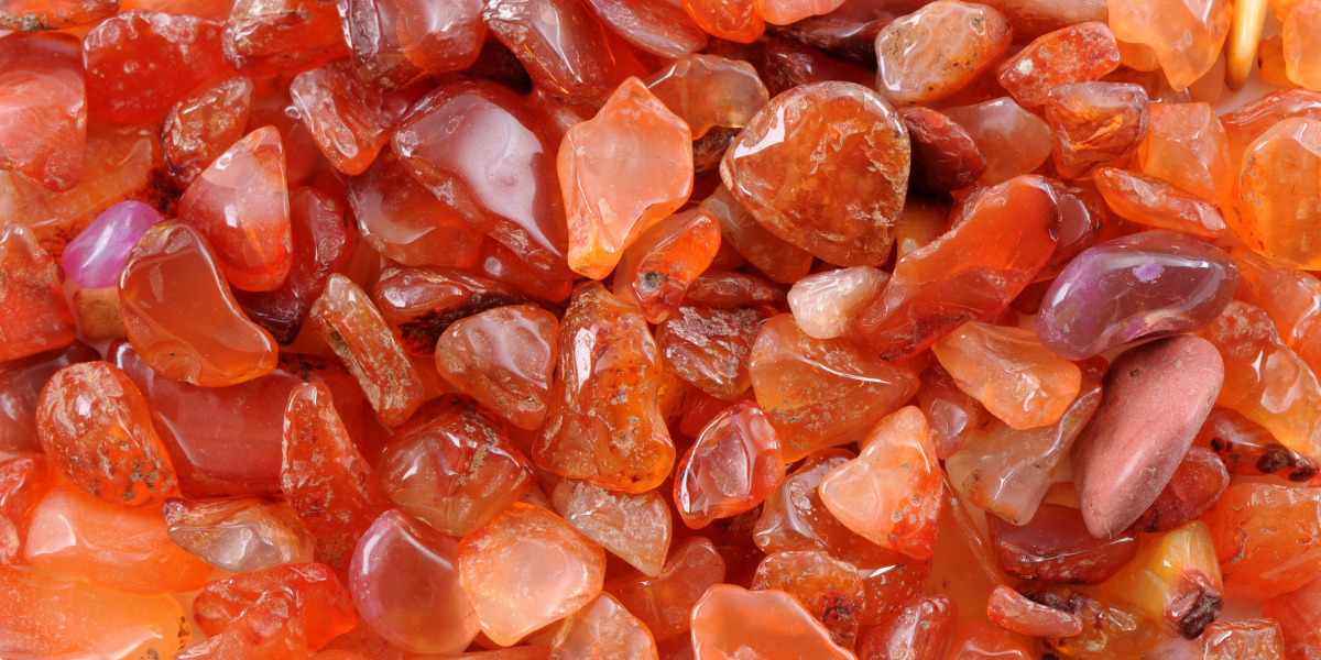 A pile of polished Carnelian crystals.